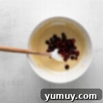 Tangy Cranberry Delights 9 Folding cranberries into cupcake batter.