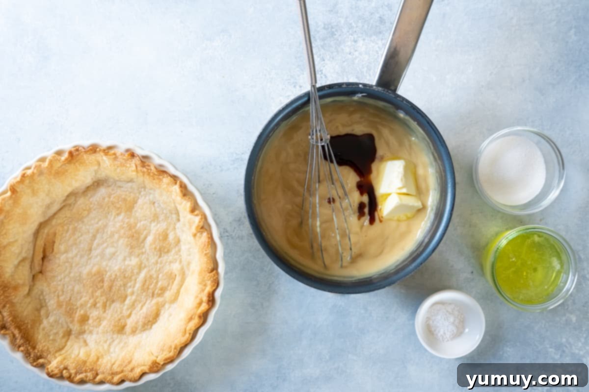 Golden Butterscotch Delight 19 The butterscotch filling in a pot, with butter and vanilla being stirred in to enrich the flavor.