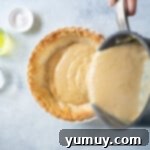 Golden Butterscotch Delight 8 Pouring the warm butterscotch filling into a prepared pie crust.