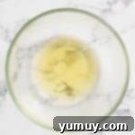 Golden Butterscotch Delight 10 Egg whites and cream of tartar in a stand mixer bowl, ready for whipping.