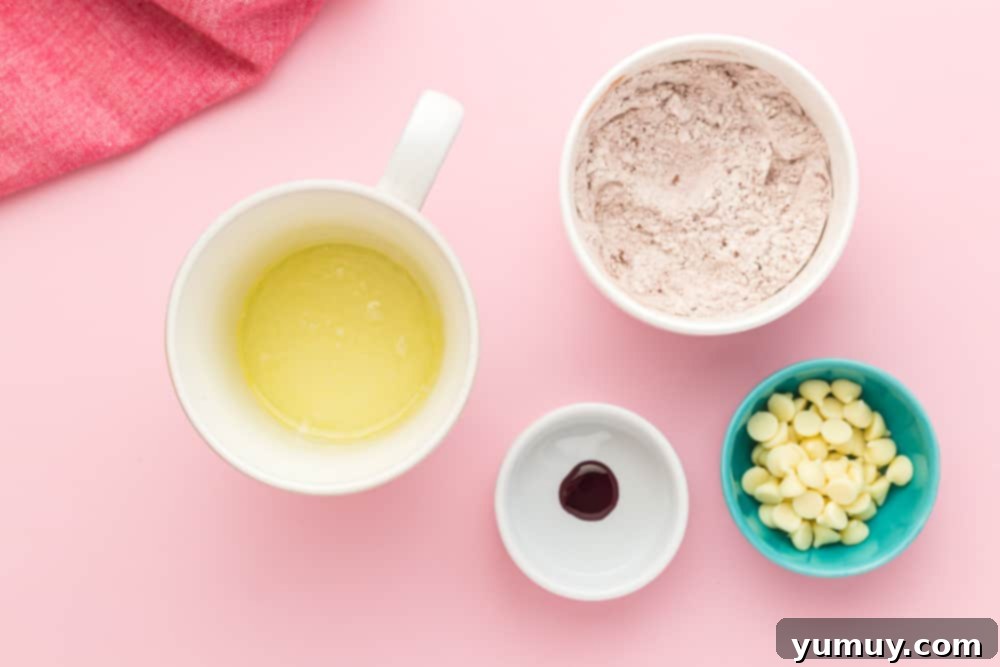 A measuring cup of flour next to a bowl of white chocolate chips, preparing for the mug cake.