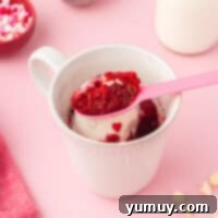 red velvet mug cake topped with white chocolate chips