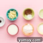 ingredients for red velvet mug cake in individual bowls