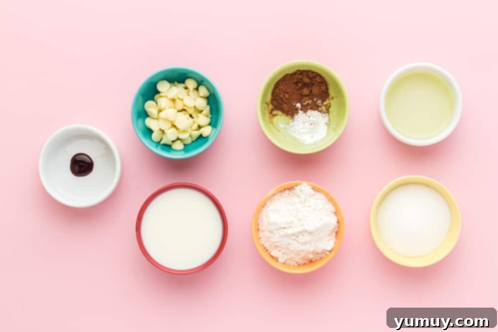 A collection of small bowls, each holding a different ingredient for the red velvet mug cake recipe.