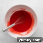 Indulgent Homemade Red Velvet Cupcakes 6 red velvet cupcake batter in a bowl