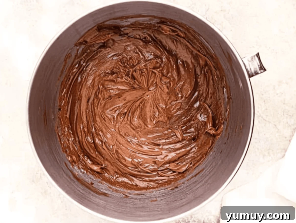 Decadent Chocolate Cream Cheese Frosting 8 chocolate cream cheese frosting in a stand mixer bowl.