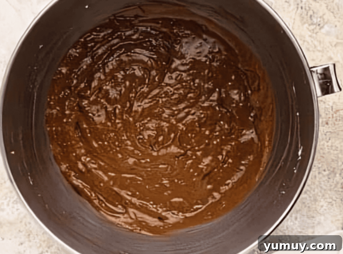 Decadent Chocolate Zucchini Cupcakes 14 chocolate cupcake batter in a stainless mixing bowl.