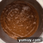 Decadent Chocolate Zucchini Cupcakes 8 chocolate cupcake batter in a stainless mixing bowl.