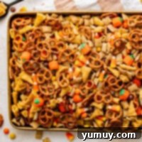 halloween chex mix on a baking sheet.