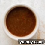 melted butter, brown sugar, and pie spice in a white bowl.