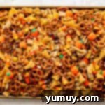 halloween chex mix on a baking sheet.