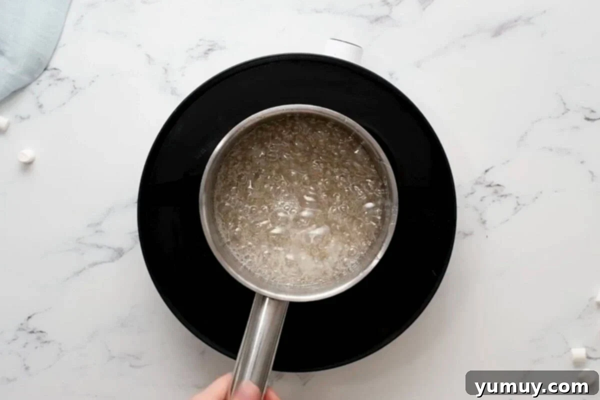 bubbling boiled sugar syrup in a saucepan.