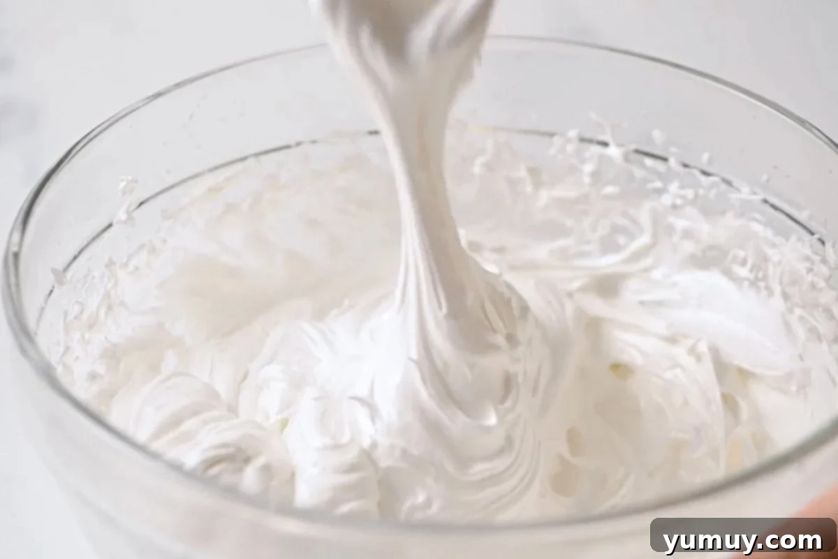 stretchy marshmallow fluff in a glass bowl.