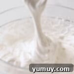 stretchy marshmallow fluff in a glass bowl.