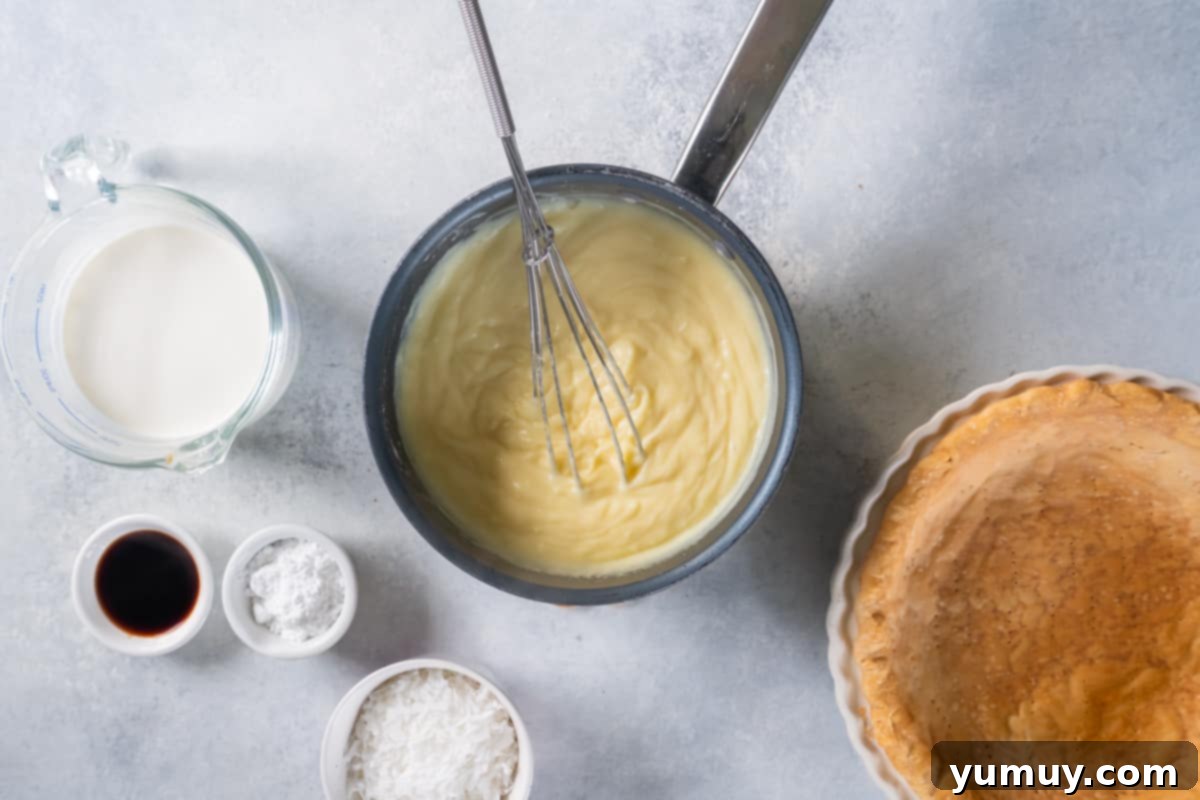 Creamy Coconut Bliss 12 the ingredients for a pie are shown in a bowl.