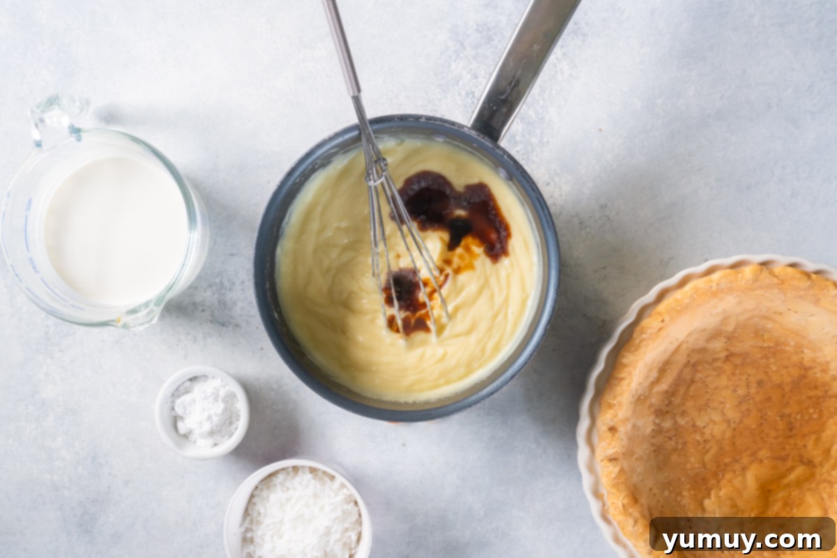 Creamy Coconut Bliss 13 whisking vanilla into the filling