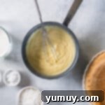 Creamy Coconut Bliss 5 the ingredients for a pie are shown in a bowl.