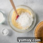 Creamy Coconut Bliss 8 mixing coconut into pie filling