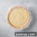 Creamy Coconut Bliss 9 finished pie covered with a piece of wax paper