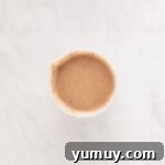 turkish coffee in a cup on a marble surface.