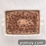 chocolate cake with holes poked in it