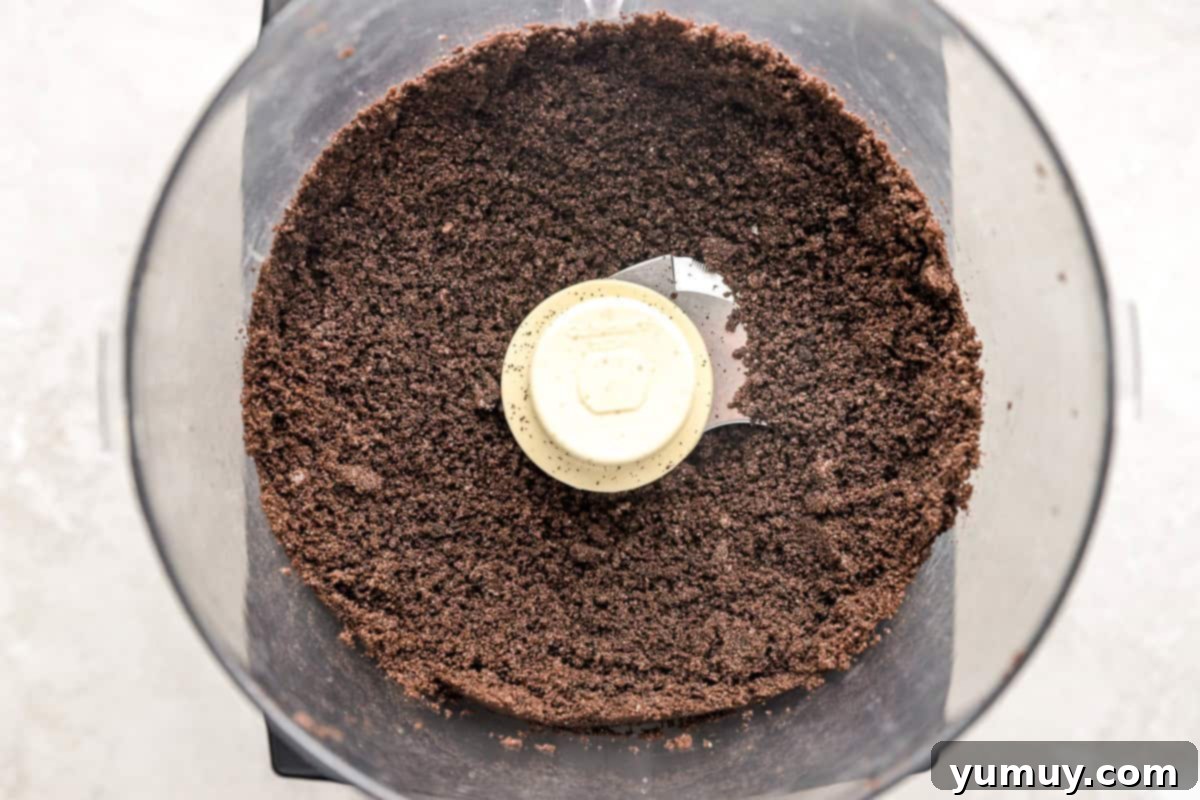 Oreo cookie crumbs in a food processor.