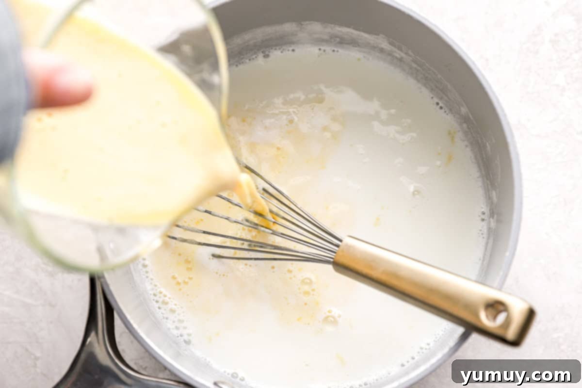 Pouring cream into a pot.
