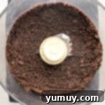 Oreo cookie crumbs in a food processor.