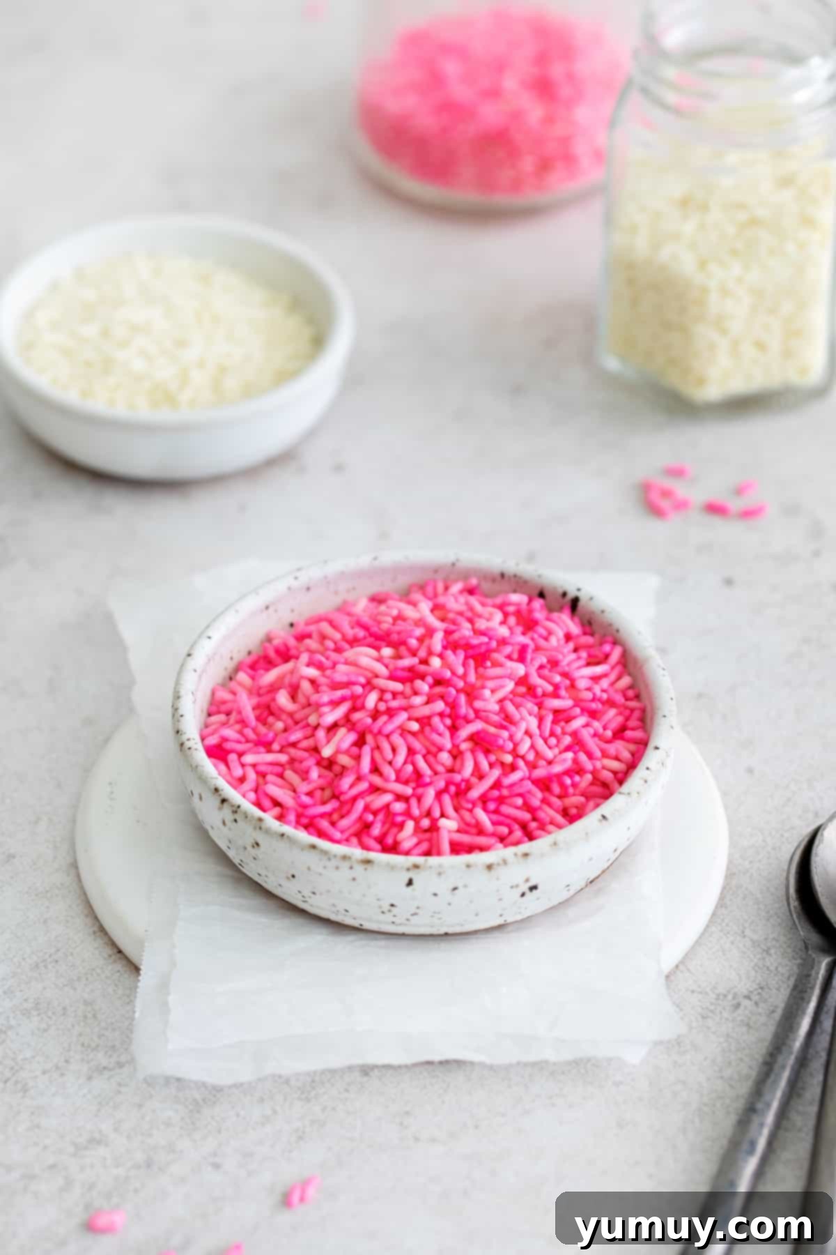 Crafting Custom Colored Sprinkles 3 A charming bowl filled with an array of DIY dyed sprinkles, showcasing the vibrant colors achieved at home.