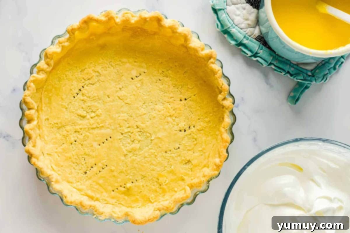 docked and baked food processor pie crust in a glass pie pan.