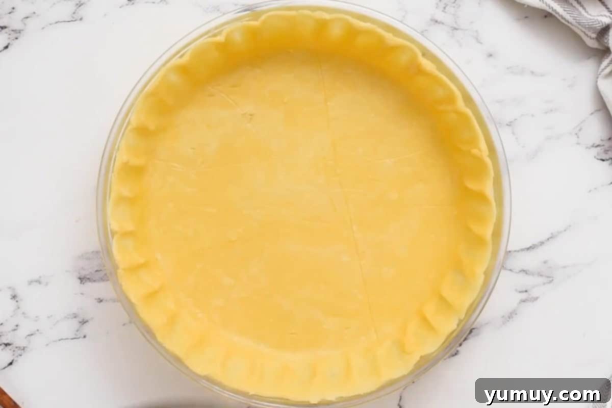 Pie crust in a pie plate, before baking.