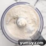 Flour, salt, and sugar combined in a food processor.