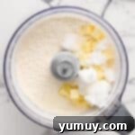 Cubes of butter and shortening added to dry ingredients in a food processor.