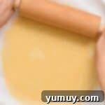 Rolling out pie crust dough.