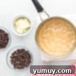 Dreamy Marshmallow Fudge 5 chocolate chip cookie dough ingredients on a marble countertop.