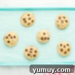 brownie stuffed chocolate chip cookies on a baking tray