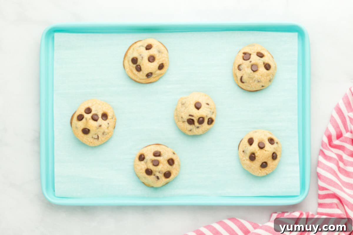 brownie stuffed chocolate chip cookies on a baking tray