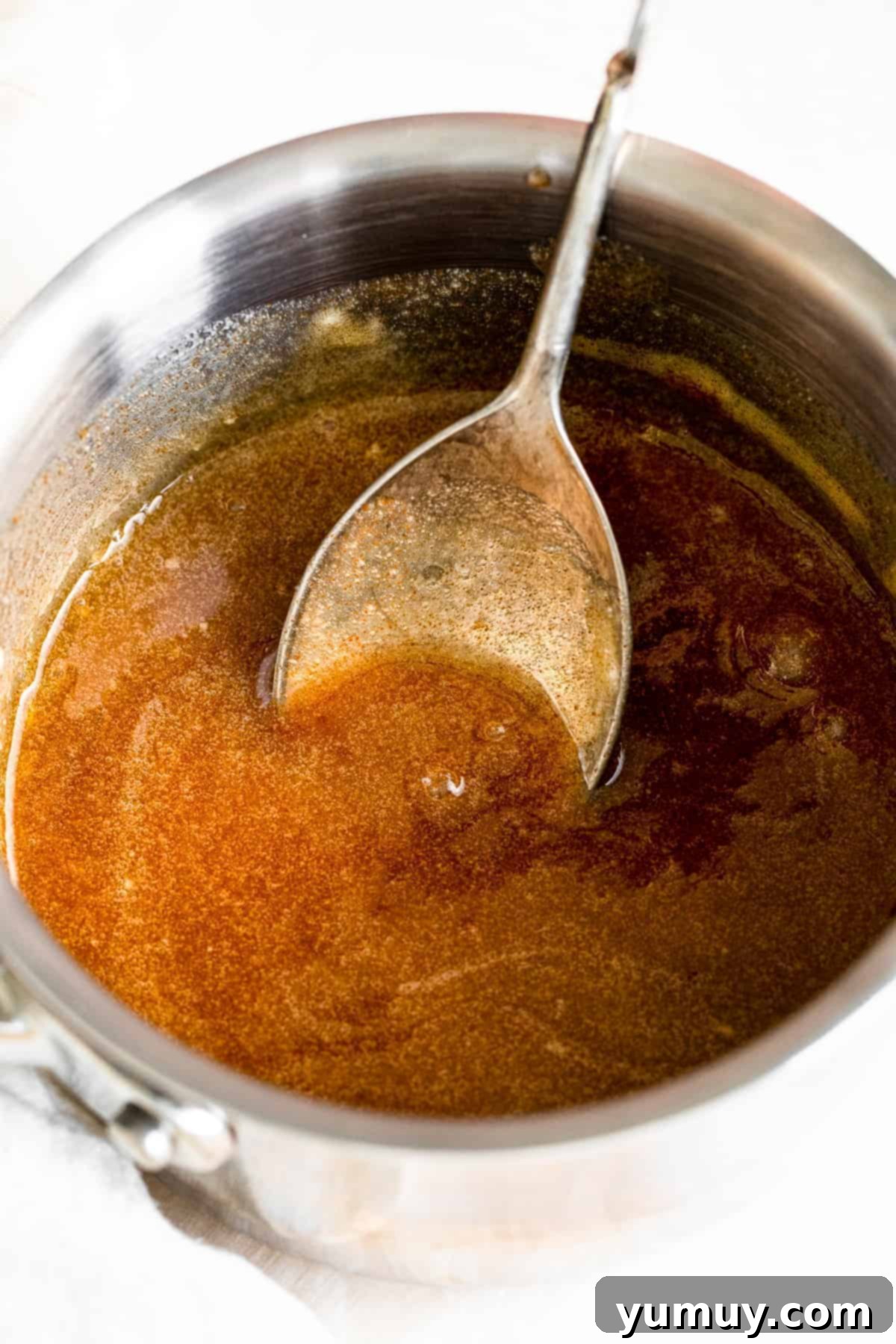 The Secret to Golden Brown Butter 3 metal spoon in brown butter