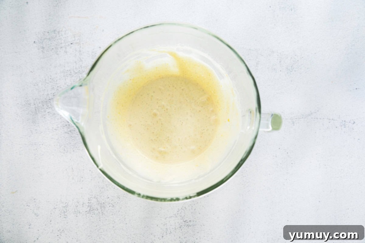 Delicate French Shell Cakes 11 whipped egg whites in a glass bowl.