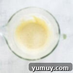 Delicate French Shell Cakes 5 whipped egg whites in a glass bowl.