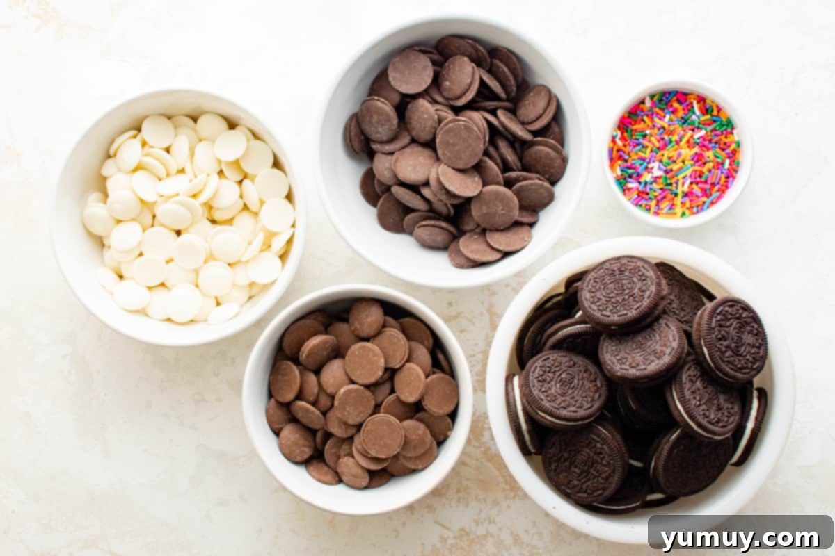 chocolate covered Oreo ingredients (cookies, chocolate melts, and sprinkles) in small bowls