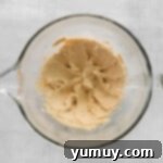 wet ingredients mixed in a glass bowl