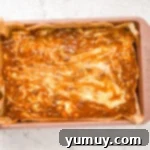 A casserole dish filled with set pralines and cream fudge, ready for cutting.