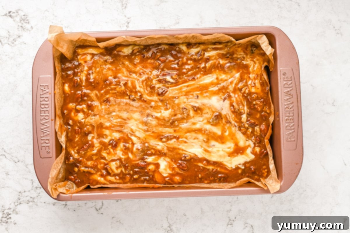 A pan of set pralines and cream fudge, ready to be cut into individual pieces.