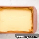 Melted white chocolate fudge smoothed into the prepared baking pan.