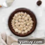 An overhead shot of a perfectly chilled and sliced mocha cheesecake, ready to be served.