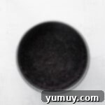 Chocolate Oreo crust firmly pressed into the base of a springform pan.