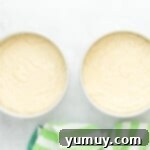 cake batter split between two round cake pans