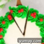 overhead view of christmas wreath cake, with green frosting around the edges