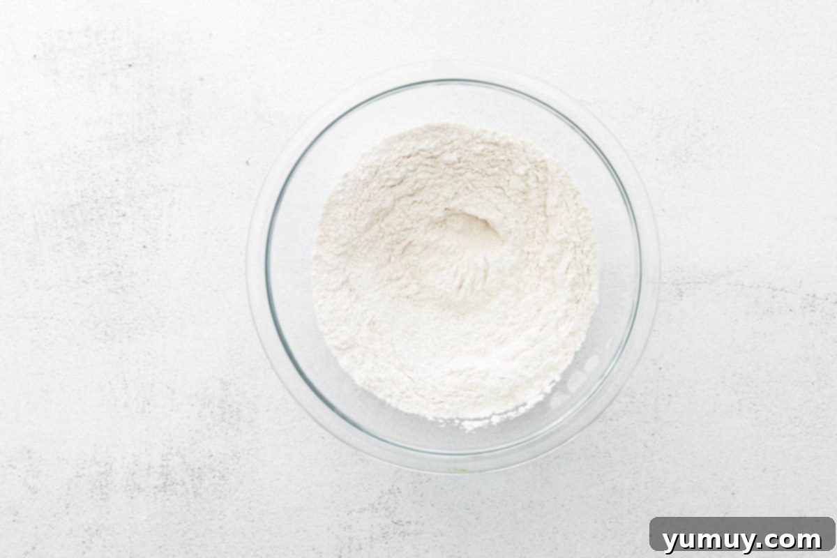 Decadent Tiramisu Cupcakes 12 dry ingredients for tiramisu cupcakes in a glass bowl.